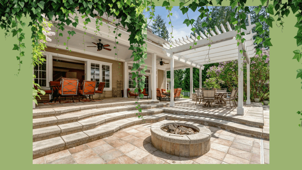 Custom backyard design in Des Moines featuring a multi-level paver patio, integrated stone fire pit, and comfortable outdoor seating area.